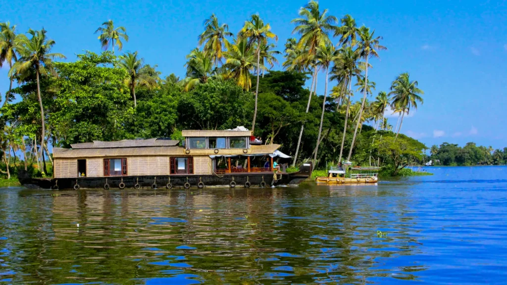 Magnificent Kerala Tour Package featuring Munnar tea gardens, Thekkady wildlife, and Alleppey backwaters with scenic landscapes and houseboat experience.